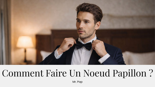 Homme en costume en train d’ajuster un noeud papillon noir.